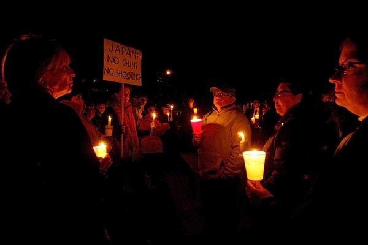 About 60 people came to a candlelight vigil at Glenoaks Park in Glendale on Saturday evening for those killed at Newtown's (Connecticut) Sandy Hook Elementary School.