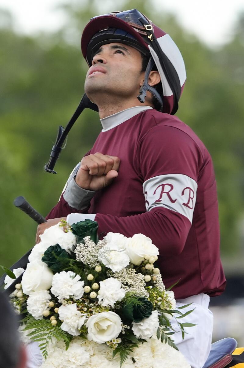Jockey Luis Saez celebrates after riding Dornoch to victory in the Belmont Stakes on Saturday.