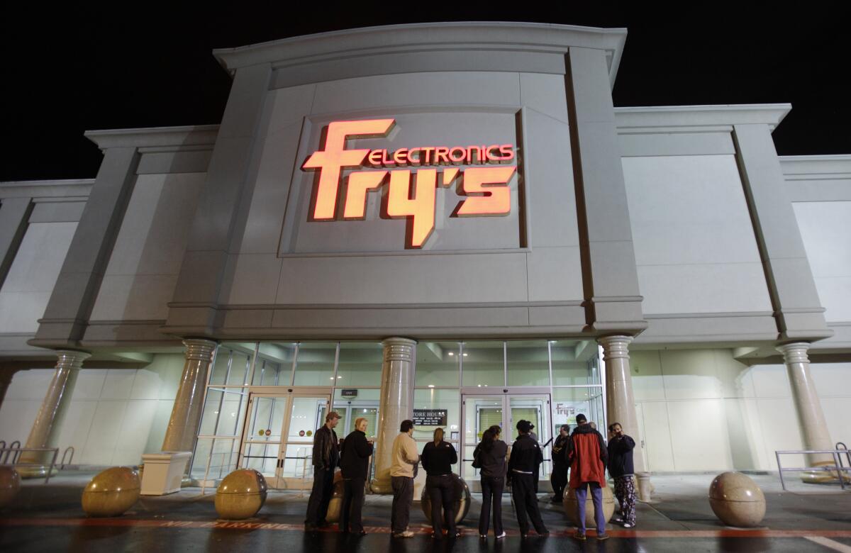People outside Fry's Electronics store in Renton, Wash.