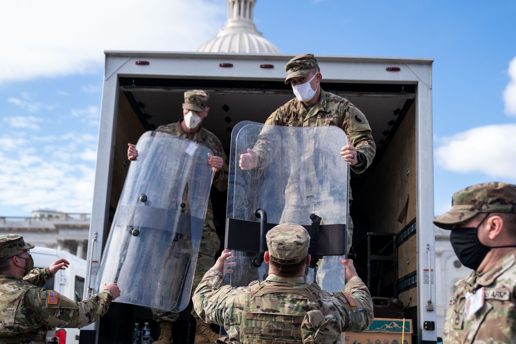 National Guard troops unload supplies outside the U.S. Capitol.