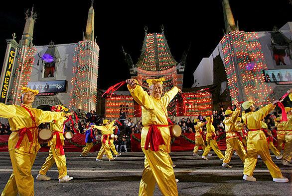 Falun Dafa dancers perform in front of the Grauman's Chinese Theatre in Hollywood, in the central region of Los Angeles.