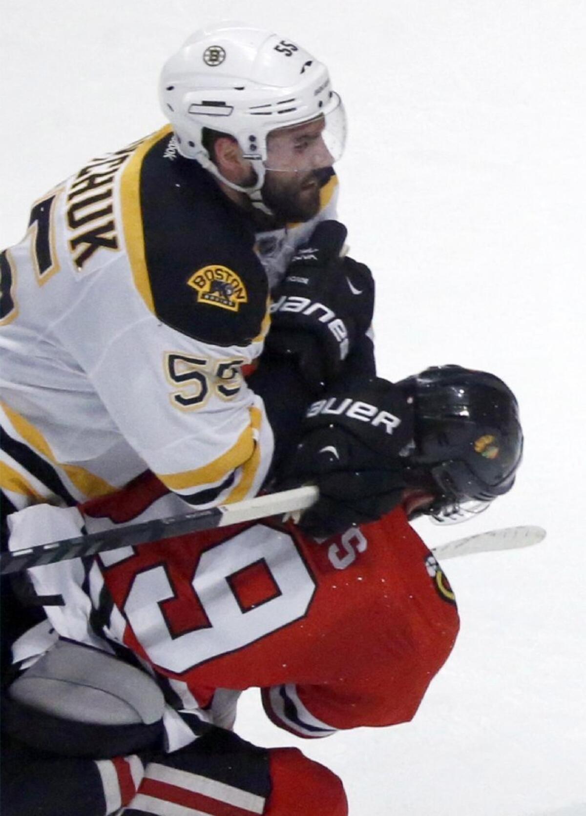 Hits to the head, such as this one from the recent NHL Finals, were outlawed prior to the 2011-12 season. Despite the ban, concussions have increased.