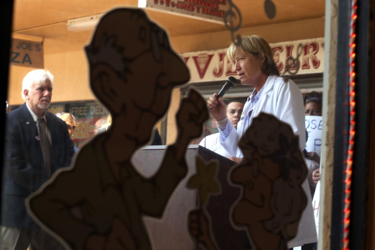 Martha Baker, a registered nurse, speaks to the media May 28 before delivering 13,000 petition signatures demanding more health coverage in Florida through the Affordable Care Act. Republicans in the state oppose expanding the state's Medicaid program.