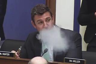 Rep. Duncan Hunter vapes at a congressional committee meeting.