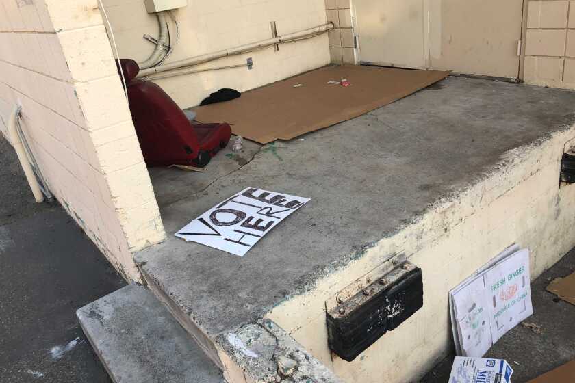 A "voting center" sign apparently discarded behind a building in Westminster that is under investigation as a phony voting center.