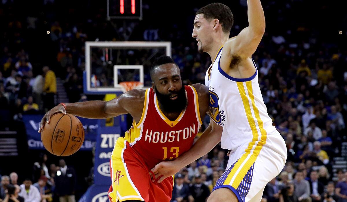 Warriors guard Klay Thompson tries to cut off a driver by Rockets guard James Harden last month.