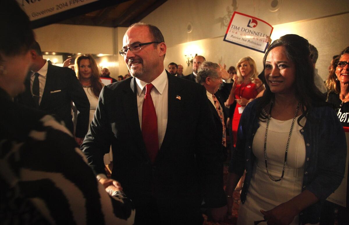Gubernatorial candidate Tim Donnelly appeared with his wife, Rowena, as polls were closing at his election night party at the Roosevelt Hotel.