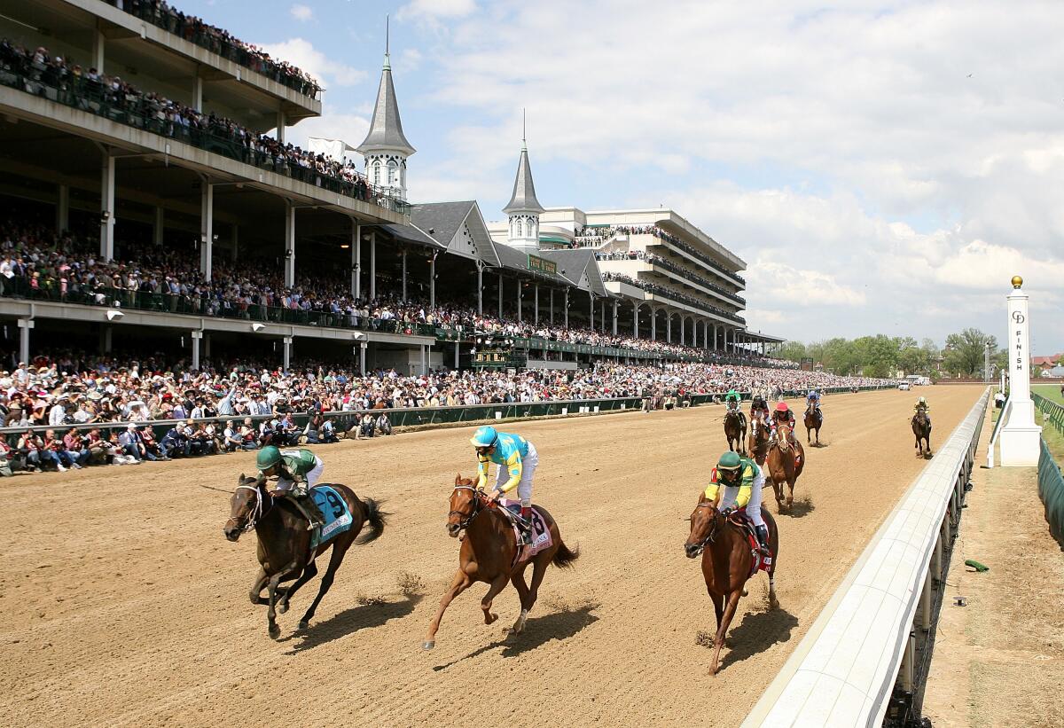 Jockeys and their horses race during the 2008 Kentucky Derby at Churchill Downs in Louisville, Ky.