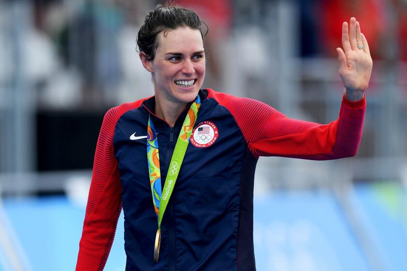 American Gwen Jorgensen on the medal stand after winning gold in the women's triathlon on Saturday.