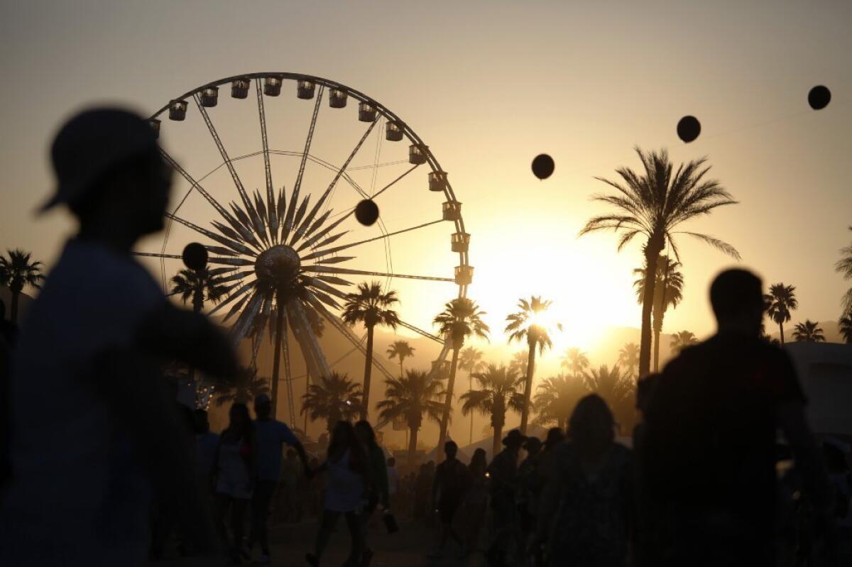 The sun can be seen setting at the 2013 edition of the Coachella Valley Music and Arts Festival.
