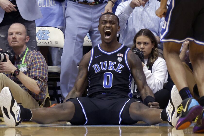 Duke forward Dariq Whitehead (0) reacts after making a shot and drawing a foul during the first half of the team's NCAA college basketball game against North Carolina, Saturday, March 4, 2023, in Chapel Hill, N.C. (AP Photo/Chris Seward)
