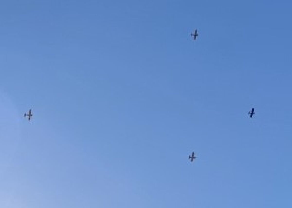 Four planes fly high above Scripps Green Hospital in La Jolla as part of an organized fly-over of San Diego-area hospitals.