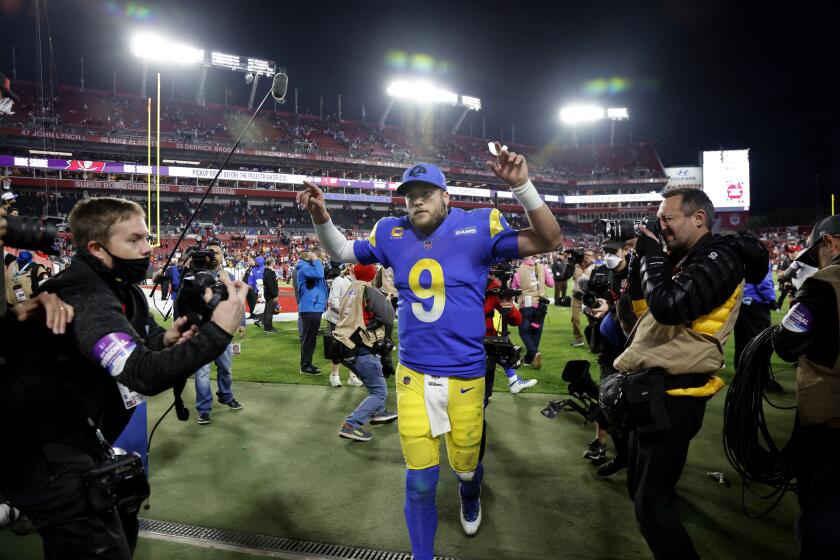 TAMPA BAY, FL- JANUARY 23, 2022: Los Angeles Rams quarterback Matthew Stafford (9) reacts to the crowd after beating the Buccaneers 30-27 in the NFC Divisional game at Raymond James Stadium on January 23, 2022 in Tampa Bay, Florida.(Gina Ferazzi / Los Angeles Times)