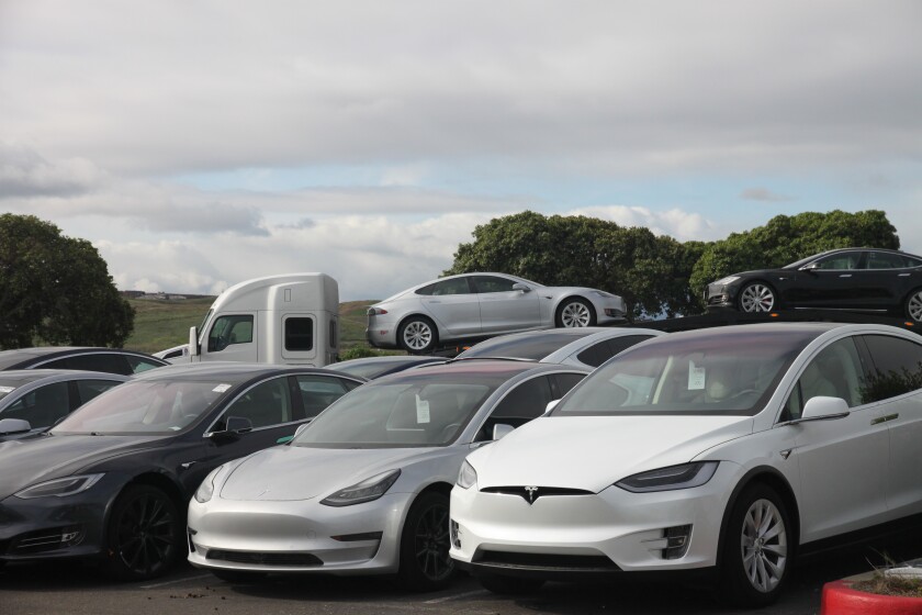 Teslas stack up at a delivery center in Fremont, Calif., on March 24.