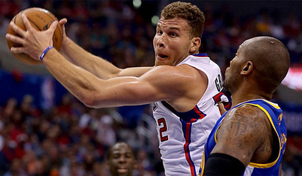 Blake Griffin drives to the basket against Golden State's Mareese Speights.