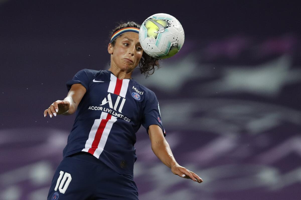 Nadia Nadim heads the ball 