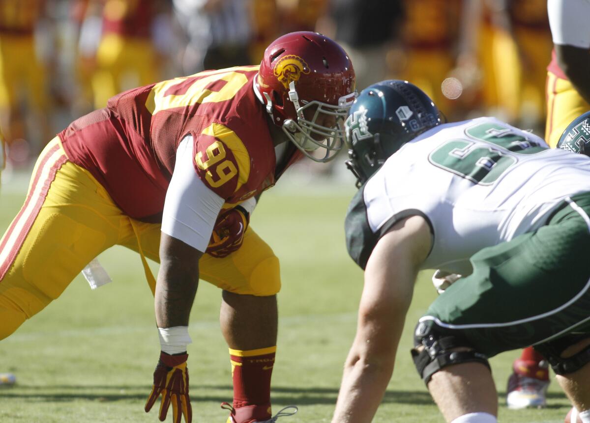 Antwaun Woods lines up for the Trojans against Hawaii during a game at the Coliseum on Sept. 1, 2012.