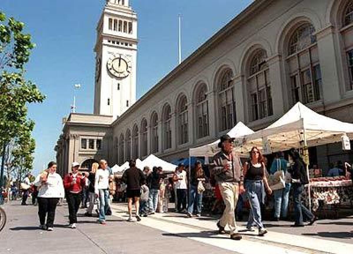 Weekend shoppers peruse organic produce at the Ferry Plaza Farmers Market on San Franciscos Embarcadero.