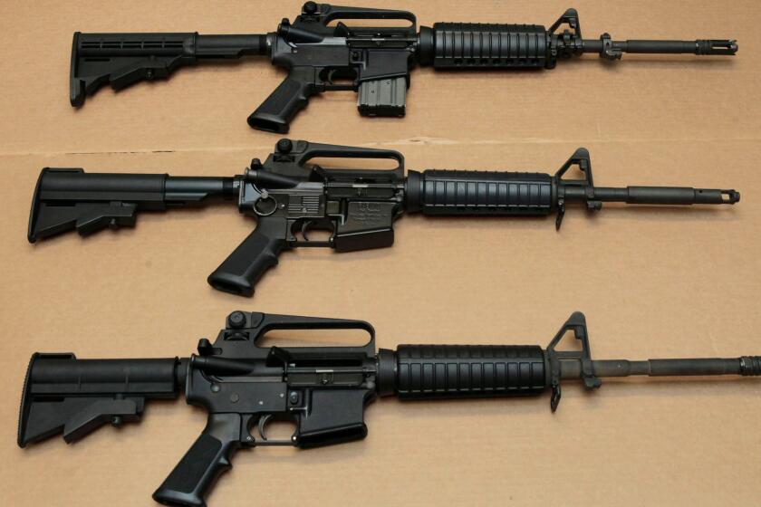 Three variations of the AR-15 assault rifle are displayed at the California Department of Justice in Sacramento.