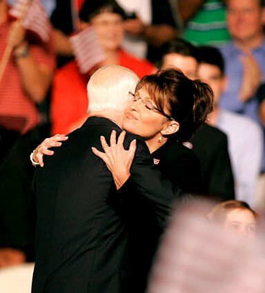 Sarah Palin gets a hug from Sen. John McCain. Former Pennsylvania Sen. Rick Santorum said of Palin: "From every indication I've seen she has a good conservative record and checks the boxes on the real important issues that conservatives care about."