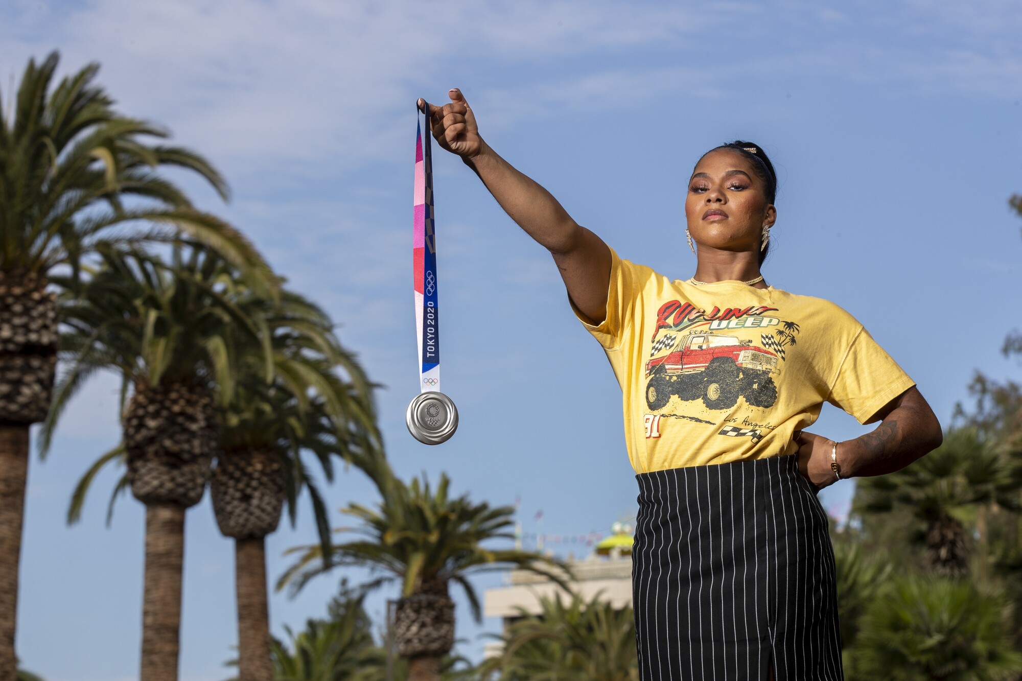 UCLA gymnast Jordan Chiles holds her Olympic silver medal 