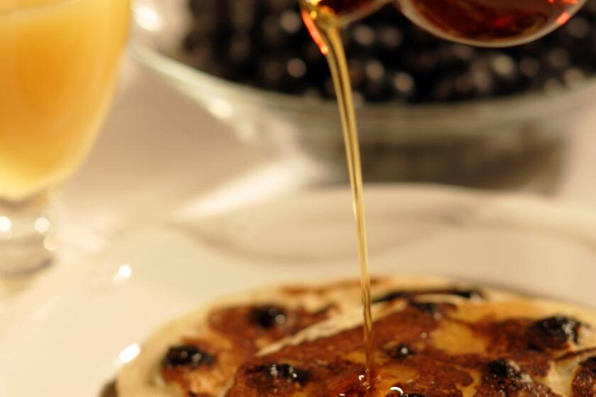 Ferazzi, Gina -- - LOS ANGELES, CA - AUGUST 7, 2008: Blueberry ricotta pancakes with maple syrup poured on top.(Gina Ferazzi/Los Angeles Times)