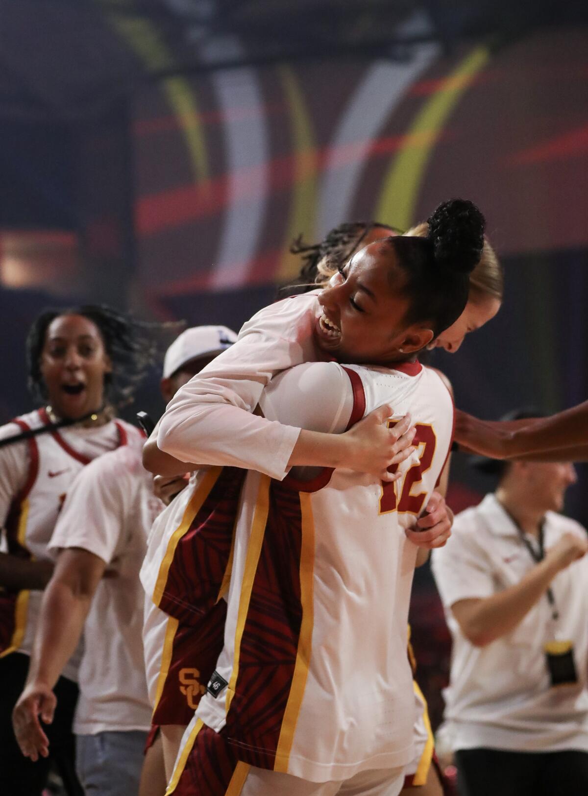 India Otto embraces JuJu Watkins, right, after the three point contest during the Trojan HoopLA event on Oct. 19.