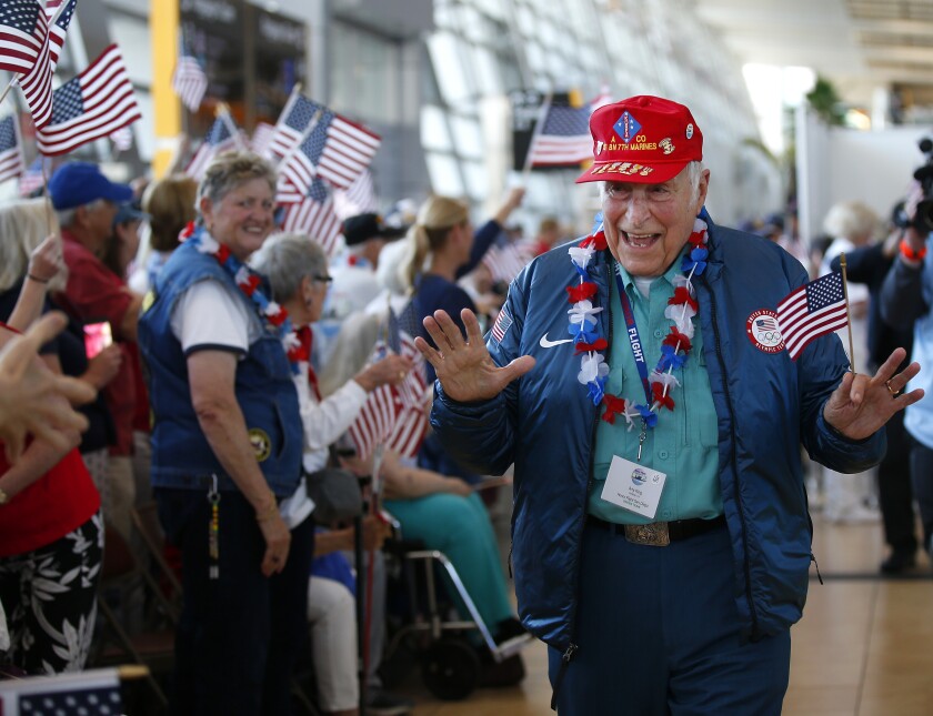 Arty King who served in the Marines in the Korean War was one of more than 80 veterans returning on a Honor Flight to San Diego International Airport on Sunday after a weekend in Washington D.C.
