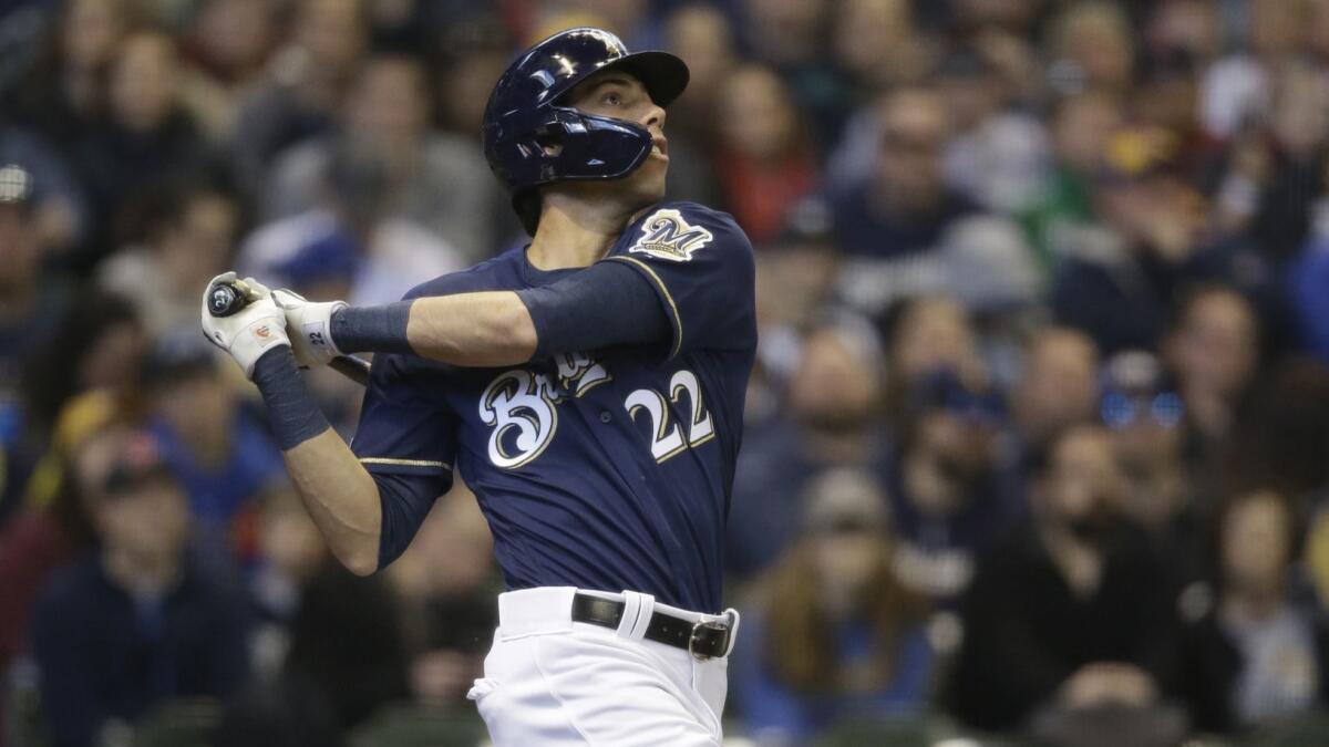 Milwaukee Brewers left fielder Christian Yelich hits a home run during the first inning of Sunday's game against the St. Louis Cardinals.