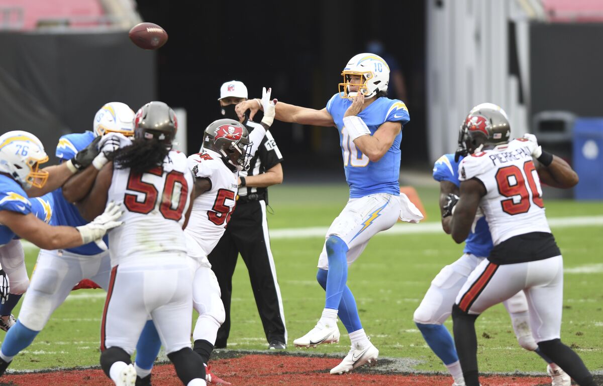  Chargers quarterback Justin Herbert (10) throws a pass against the Tampa Bay Buccaneers.