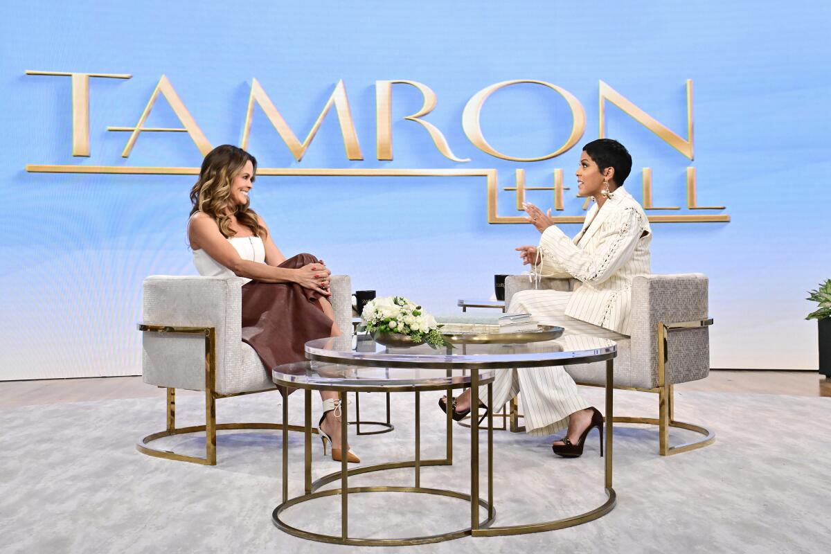 Model and fitness expert Brooke Burke with talk show host Tamron Hall.