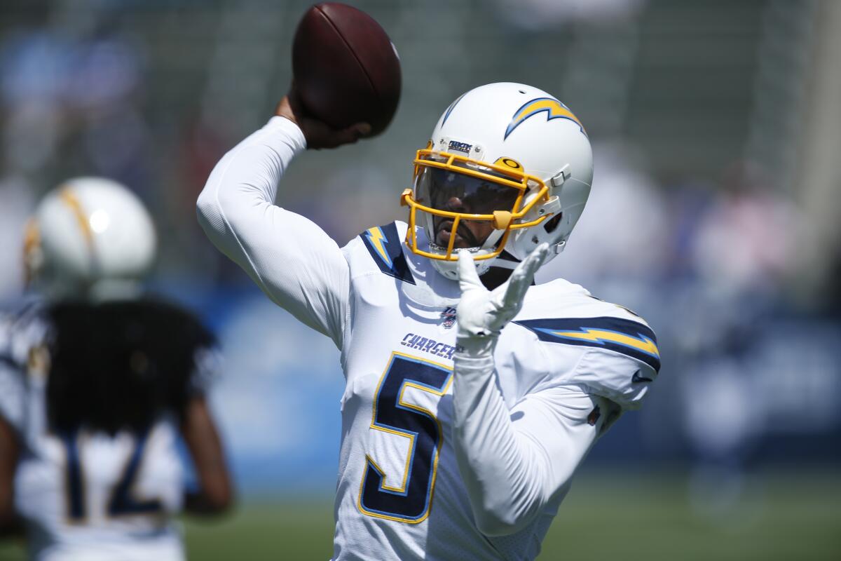 Chargers quarterback Tyrod Taylor throws a pass.