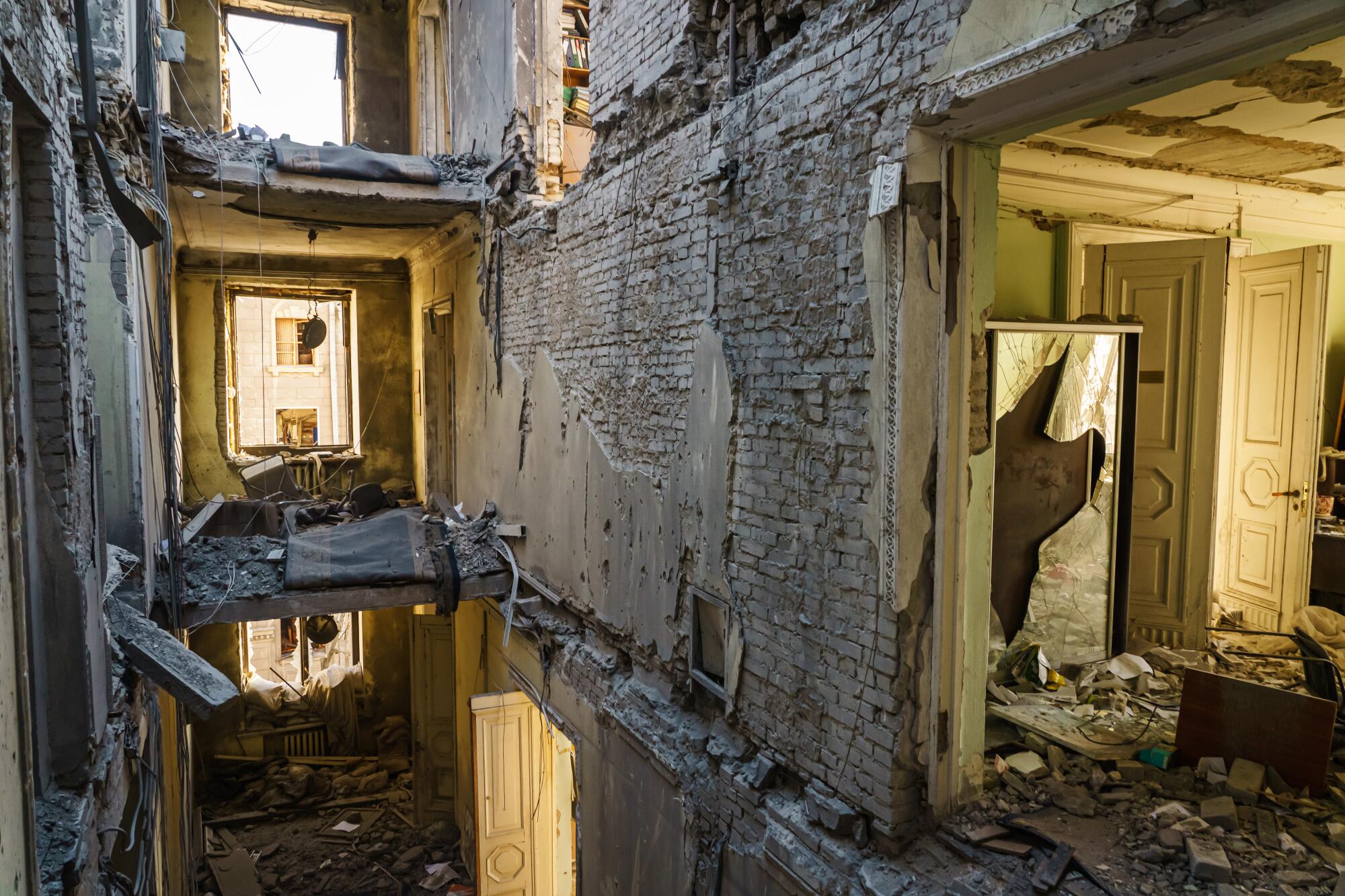 Debris seen inside three floors of a damaged office building.