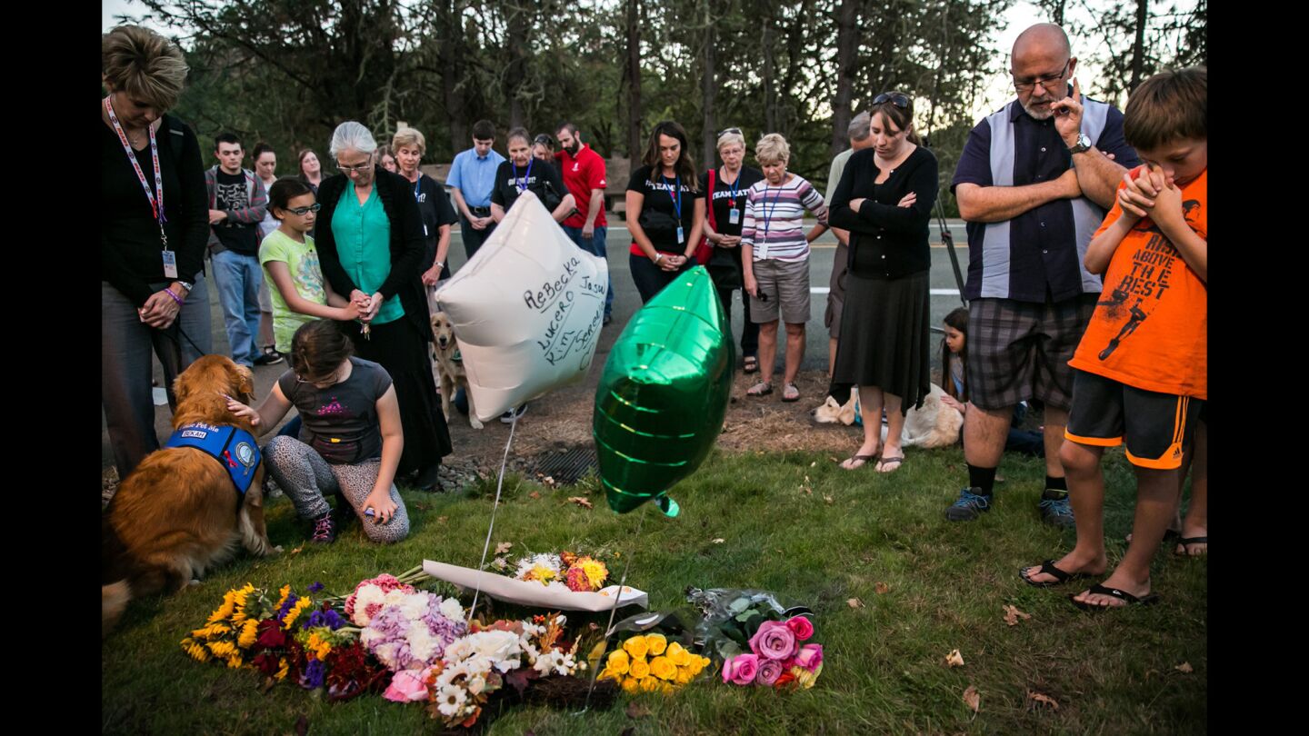 Local and national church groups, along with community members, gather on Oct. 4 to pray at a makeshift memorial outside Snyder Hall, the building at Umpqua Community College in Roseburg, Ore., where the mass shooting occurred.