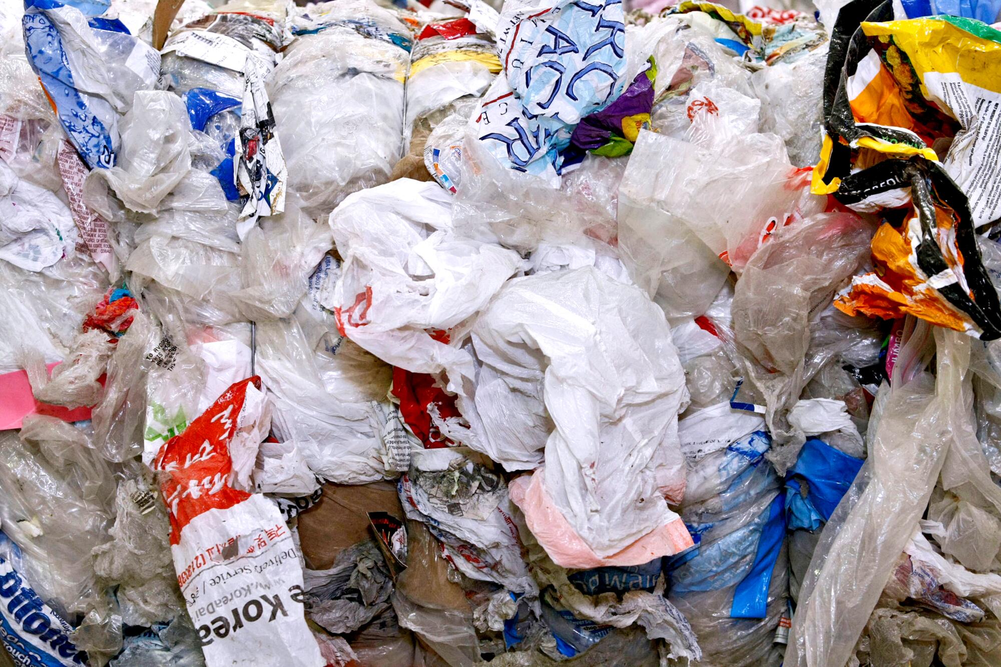 An up-close photo of a bale of plastic bags