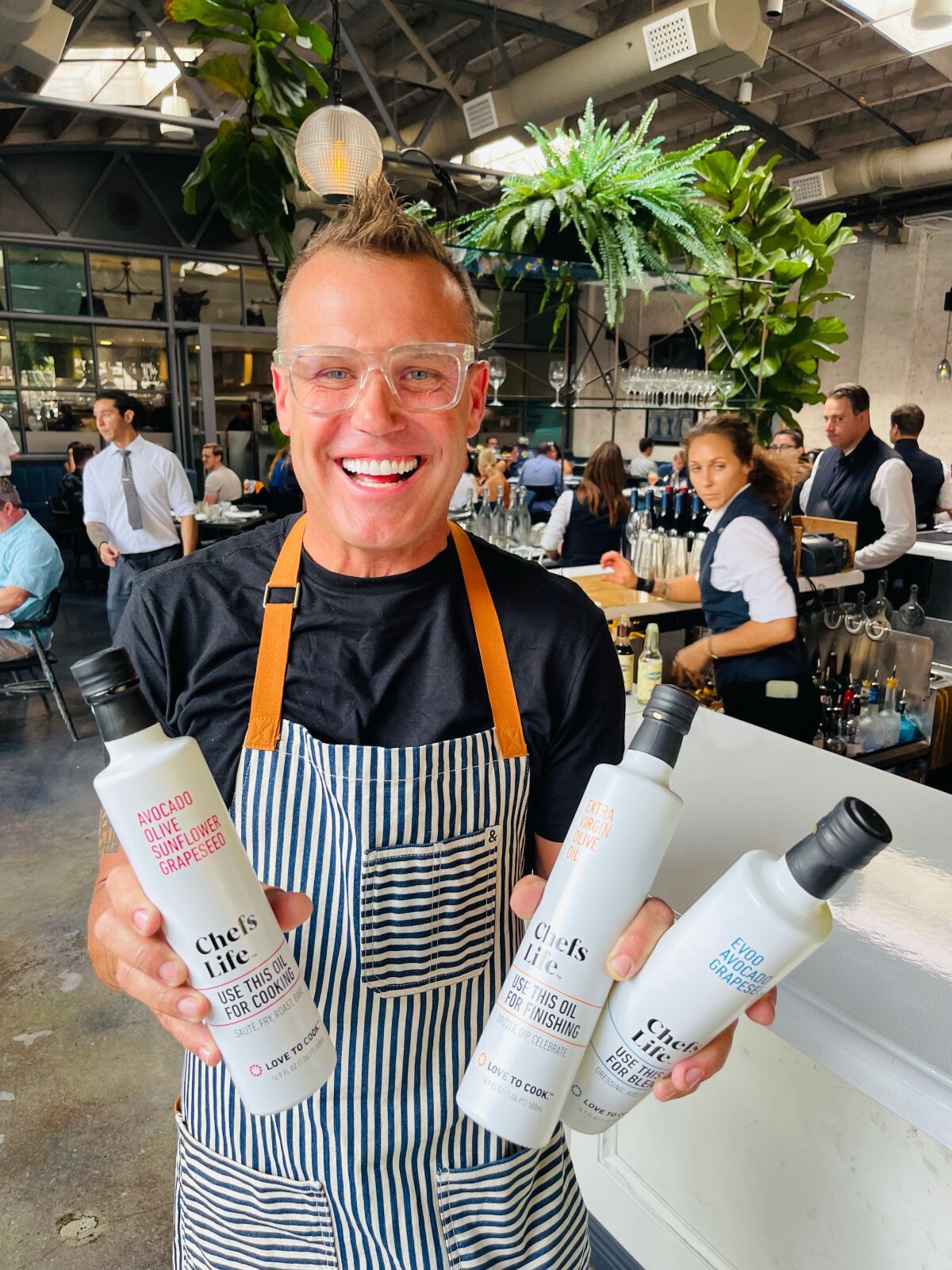 Chef Brian Malarkey with his three Chefs Life products, which were introduced in August.