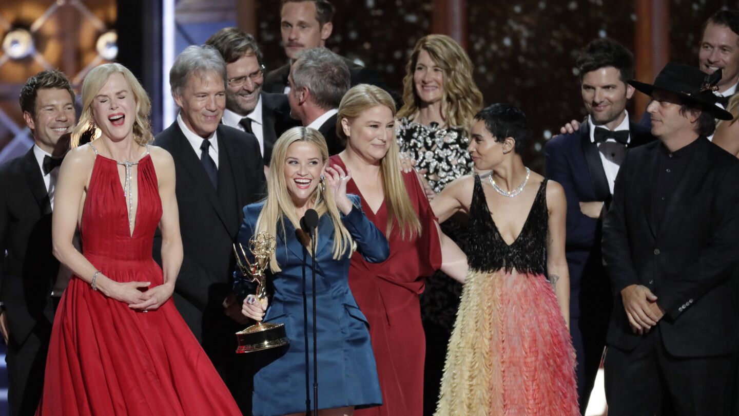 Reese Witherspoon, center, accepts for "Big Little Lies" afer winning the Emmy fpr limited series.