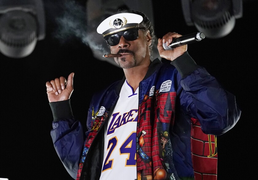 FILE - Snoop Dogg performs a DJ set as "DJ Snoopadelic" during the "Concerts In Your Car" series on Oct. 2, 2020, in Ventura, Calif. The rapper will join Def Jam Recordings as an executive creative and strategic consultant. (AP Photo/Chris Pizzello, File)