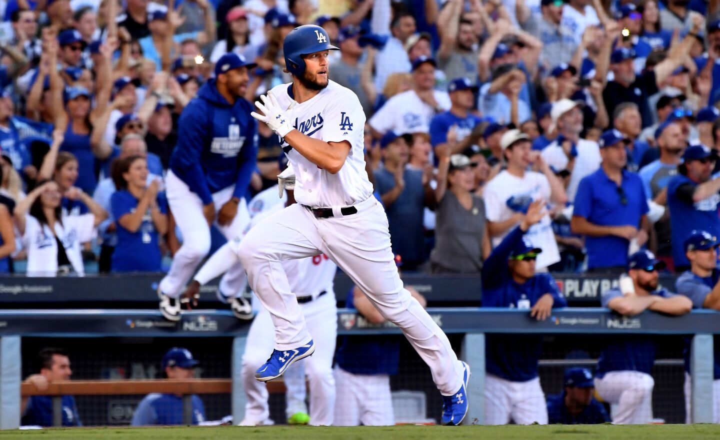 Clayton Kershaw scores a run on Justin Turner's RBI against the Brewers in the 7th inning.