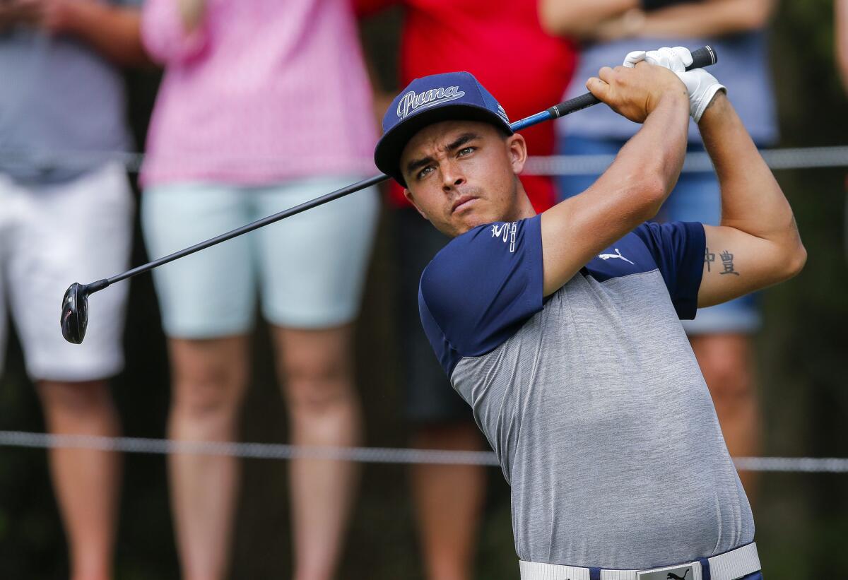 Rickie Fowler hits a tee shot on the eighth hole at TPC Sawgrass on May 10 ahead of The Players Championship.