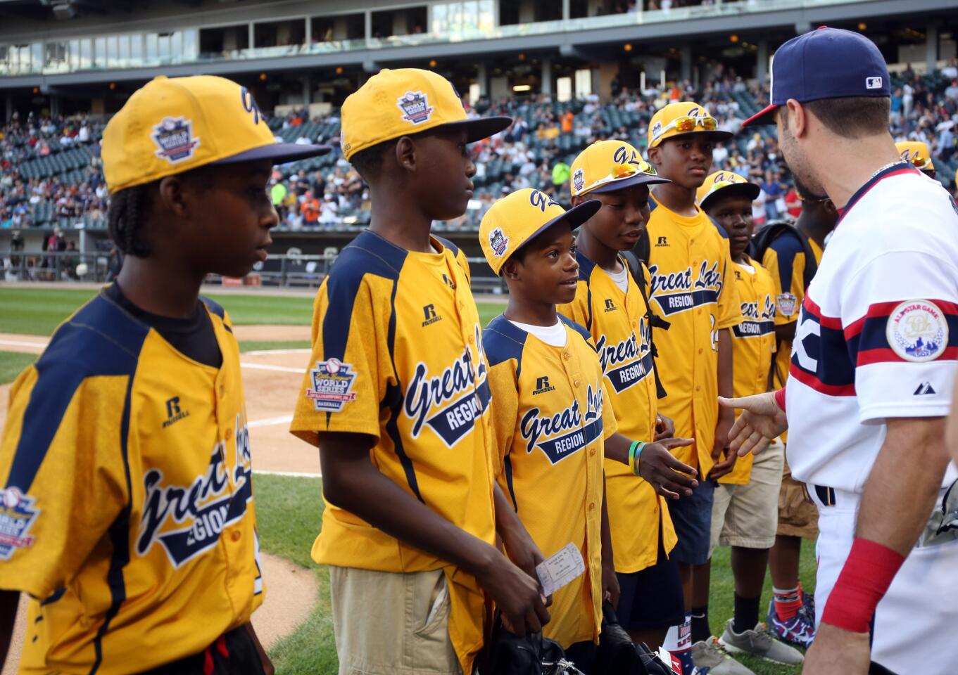 Adam Eaton greets Jackie Robinson West players before the game.