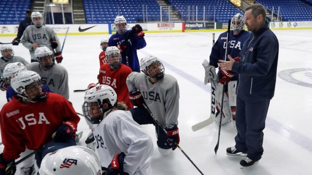 Team USA Coach Robb Stauber talks to his players during a practice session in Plymouth, Mich., on Dec. 15, 2016.