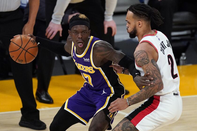 Portland Trail Blazers guard Gary Trent Jr. (2) defends against Los Angeles Lakers guard.
