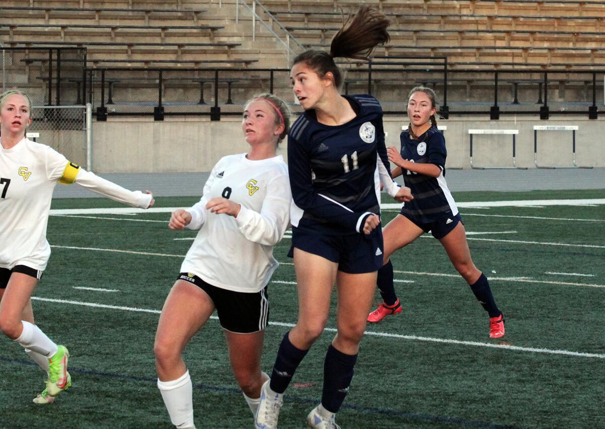 Newport Harbor's Isabelle Whittaker (11) heads in the second goal of the game against Capistrano Valley on Wednesday.