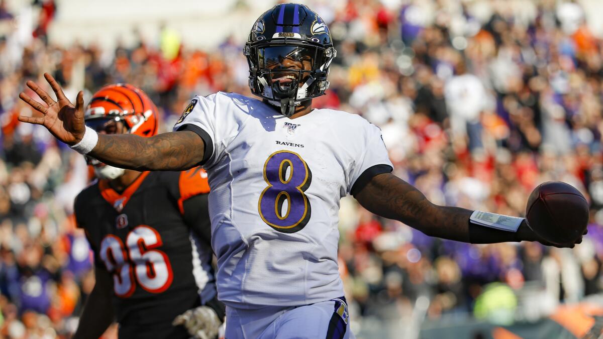 Ravens quarterback Lamar Jackson scores on a run against the Bengals during a game on Nov. 10, 2019, in Cincinnati.