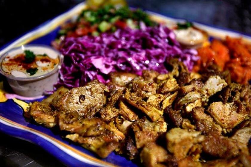 The chicken shawarma can be ordered with such sides as slaw-like purple cabbage.