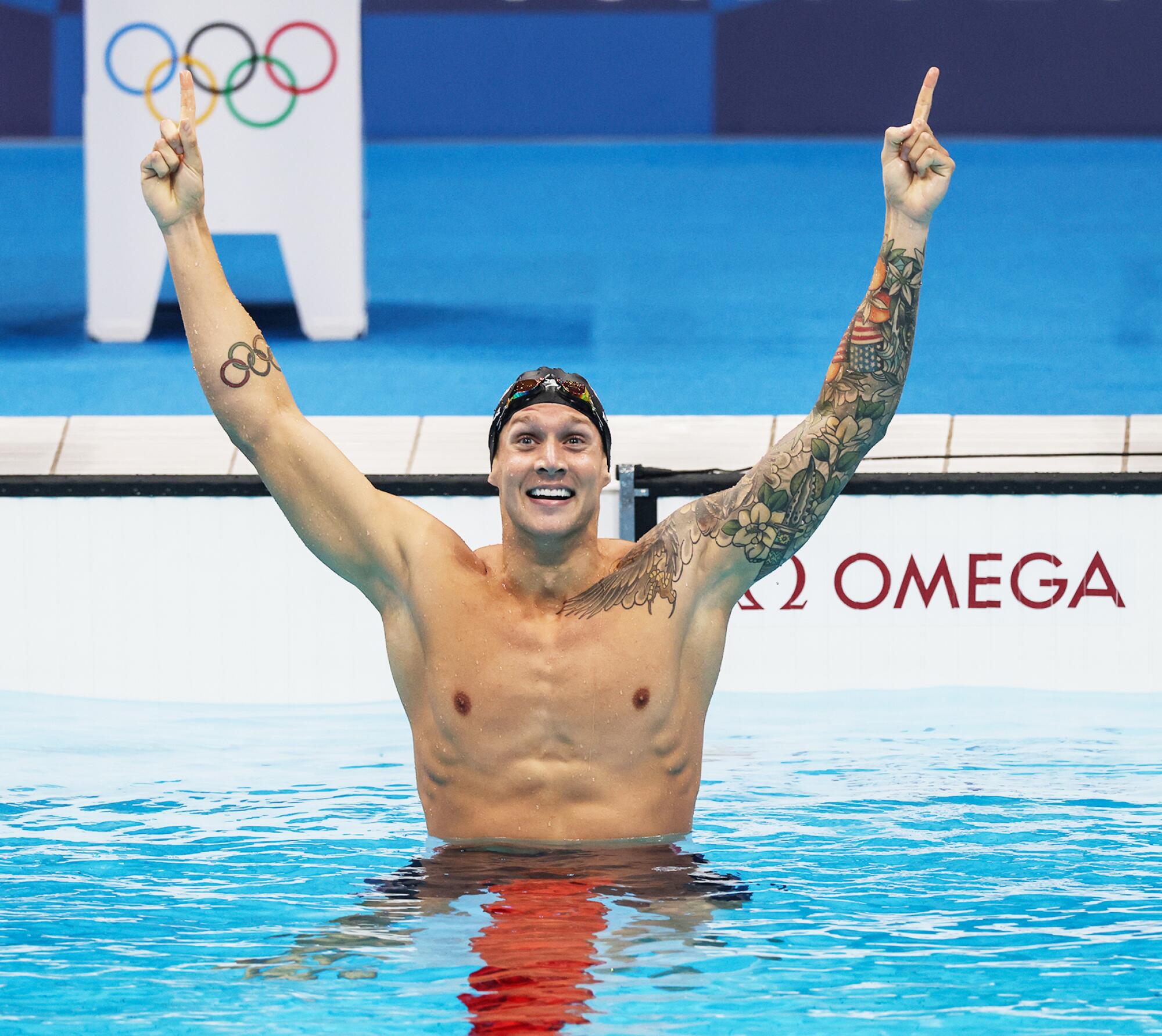 United States' Caeleb Dressel celebrates after winning the gold medal in the 100-meter freestyle