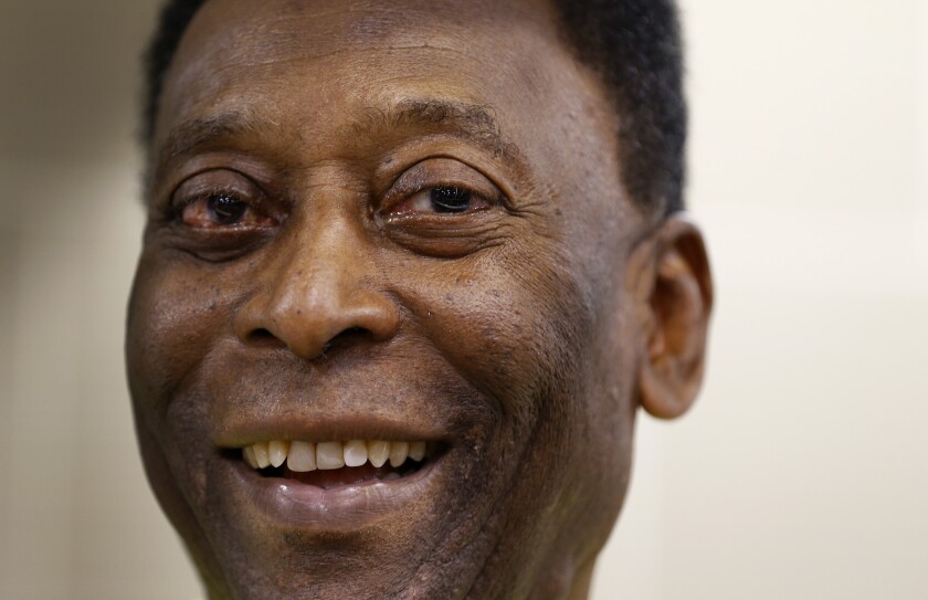 FILE - In this March 20, 2015 file photo, Brazilian soccer legend Pele smiles during a media opportunity at a restaurant in London. Rio's state legislature voted the second week of March 2021, to give Gov. Claudio Castro the authority to rename the historic Maracana stadium after Pele. (AP Photo/Kirsty Wigglesworth, File)