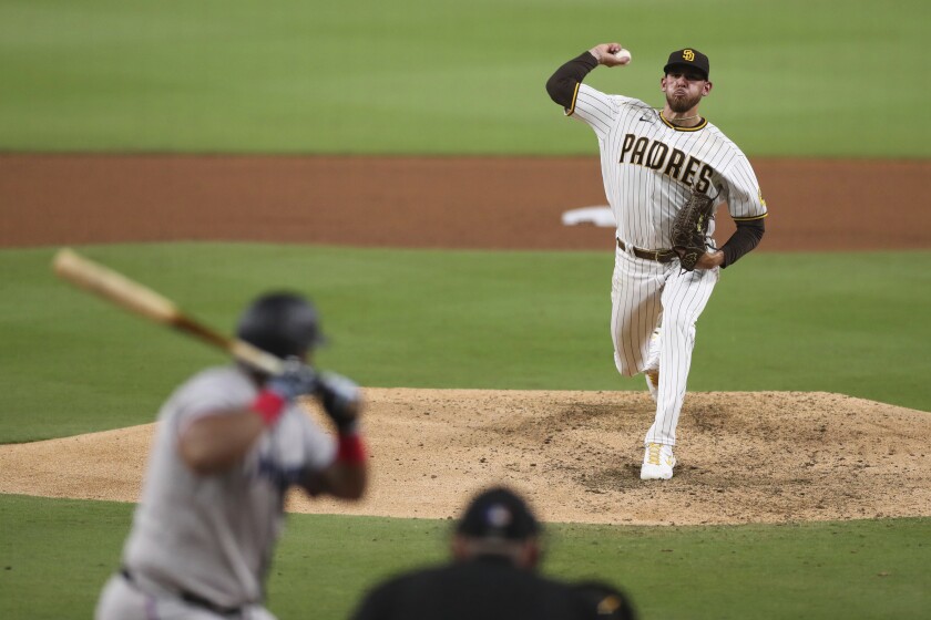 San Diego Padres starting pitcher Joe Musgrove delivers to Miami Marlins' Jesus Aguilar in the fifth inning of a baseball game Monday, Aug. 9, 2021, in San Diego. (AP Photo/Derrick Tuskan)