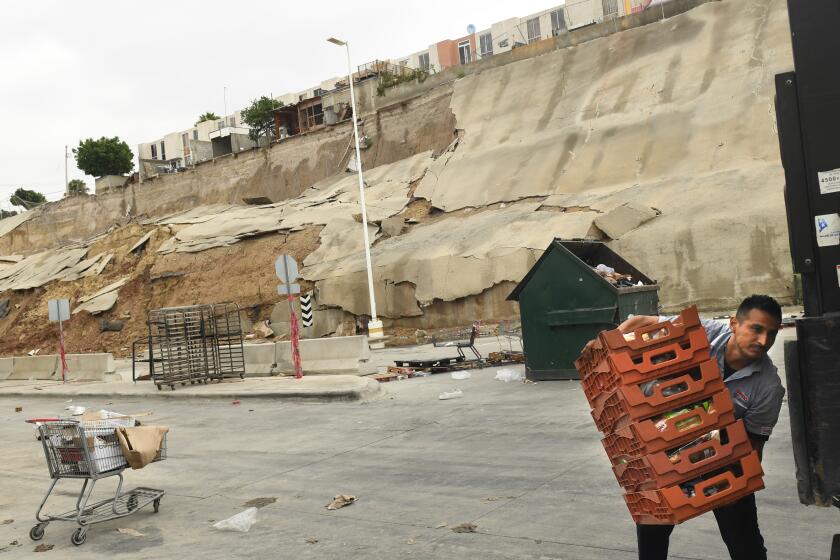 Tijuana, Mexico August 21, 2023-A wall collapsed in Tijuana after Tropical Storm Hilary passed through Mexico Sunday. (Wally Skalij/Los Angles Times)